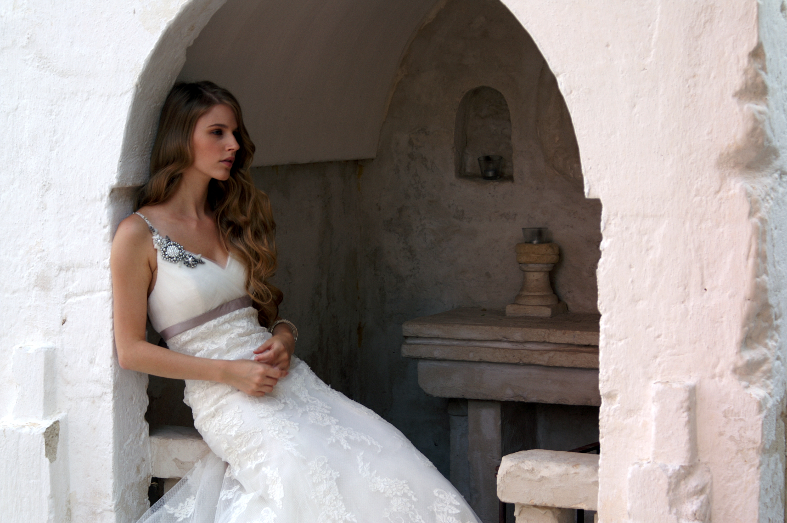 Model at Masseria Cimino wearing white wedding dress during photo shooting