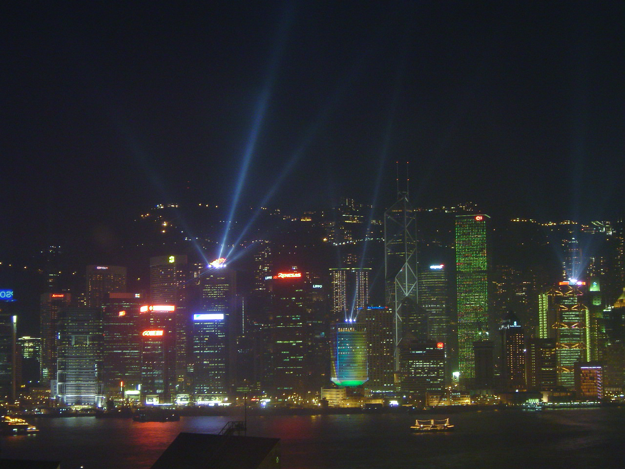 Hong Kong skyline laser light show on top of towers at night