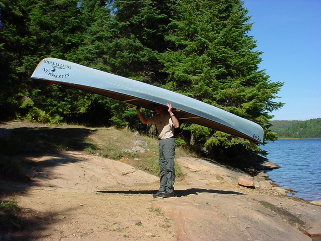 Walter carrying a canoe during a portage in Algonquin Provincial Park, Ontario, Canada