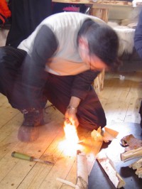Walter making fire in Finnish chalet in Lapland.