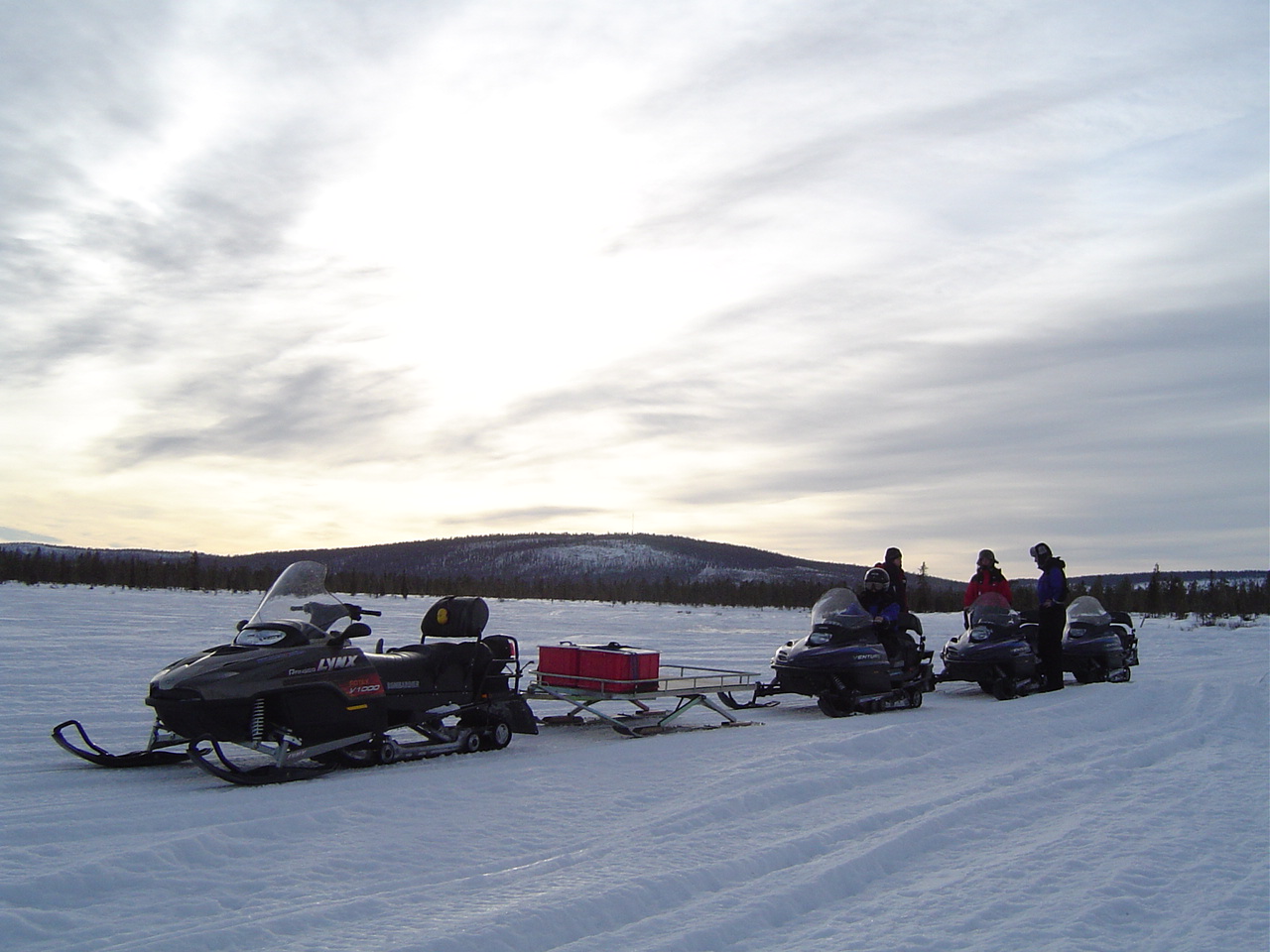 Snow mobiles ready for a full-day excursion including lunch