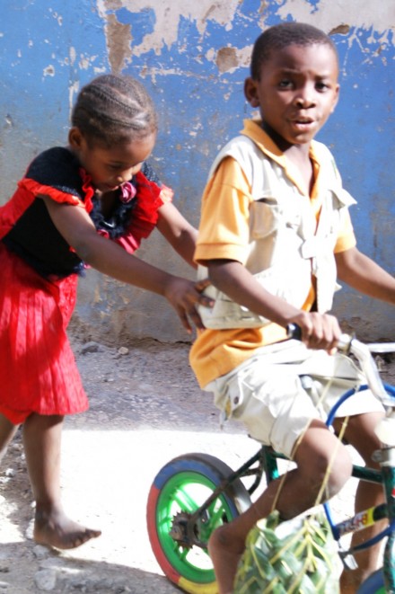 Kids learning business bicycles in Stonetown, Zanzibar