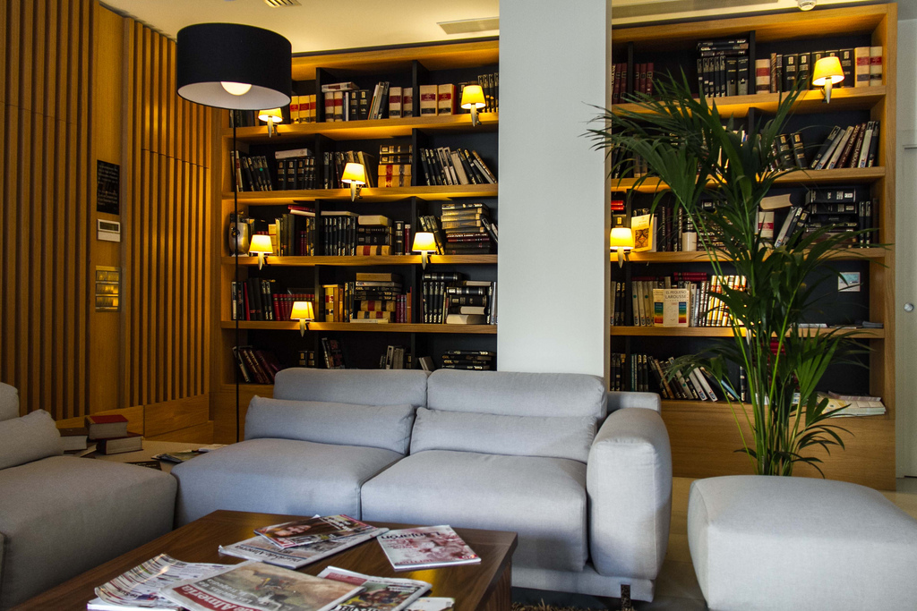 Library and couche at lobby of Plaza Vieja Hotel & Lounge in Almeria