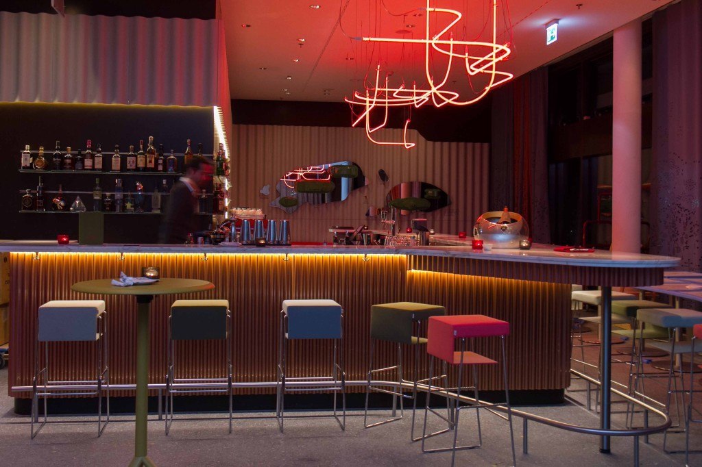 Hotel bar with red neon sculpture 