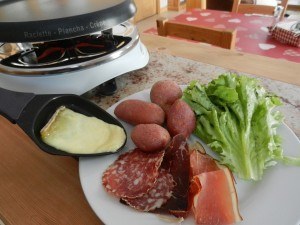 Raclette - traditional Swiss alpine melted-cheese dish