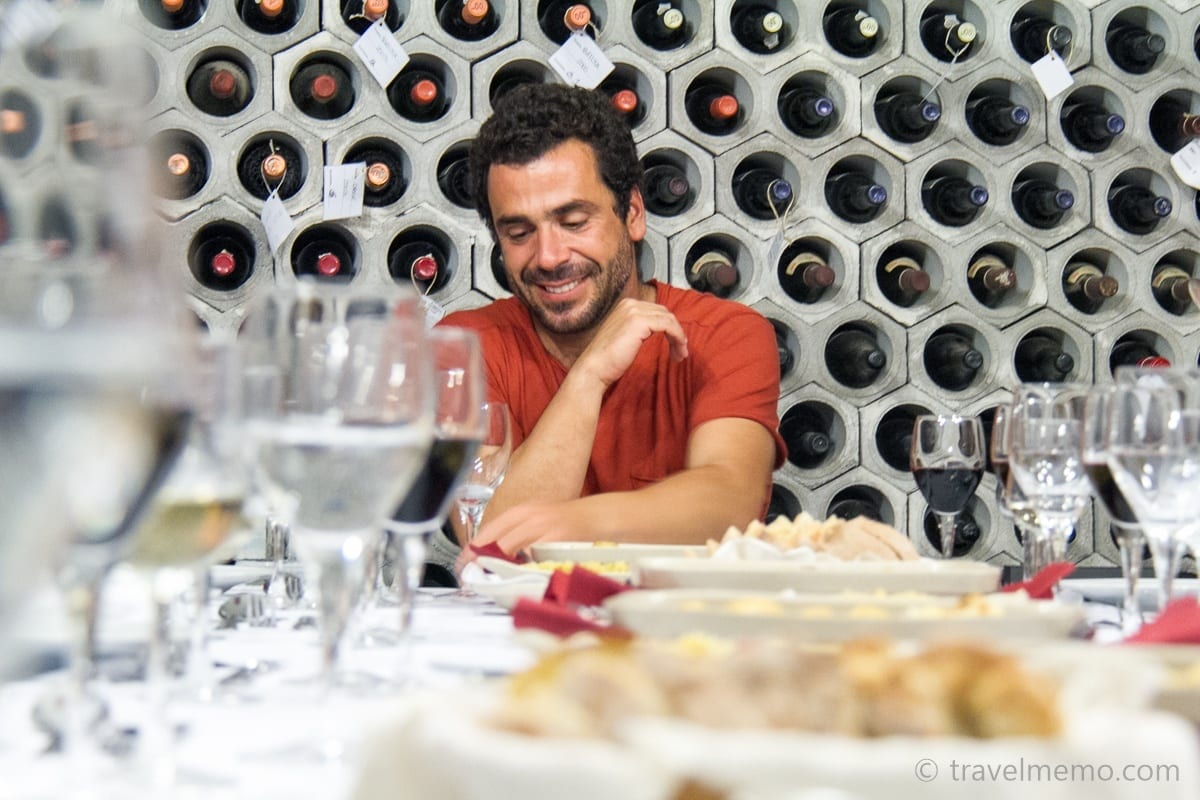 Hotel owner Gonçalo Alves chatting at wine cellar dinner experience