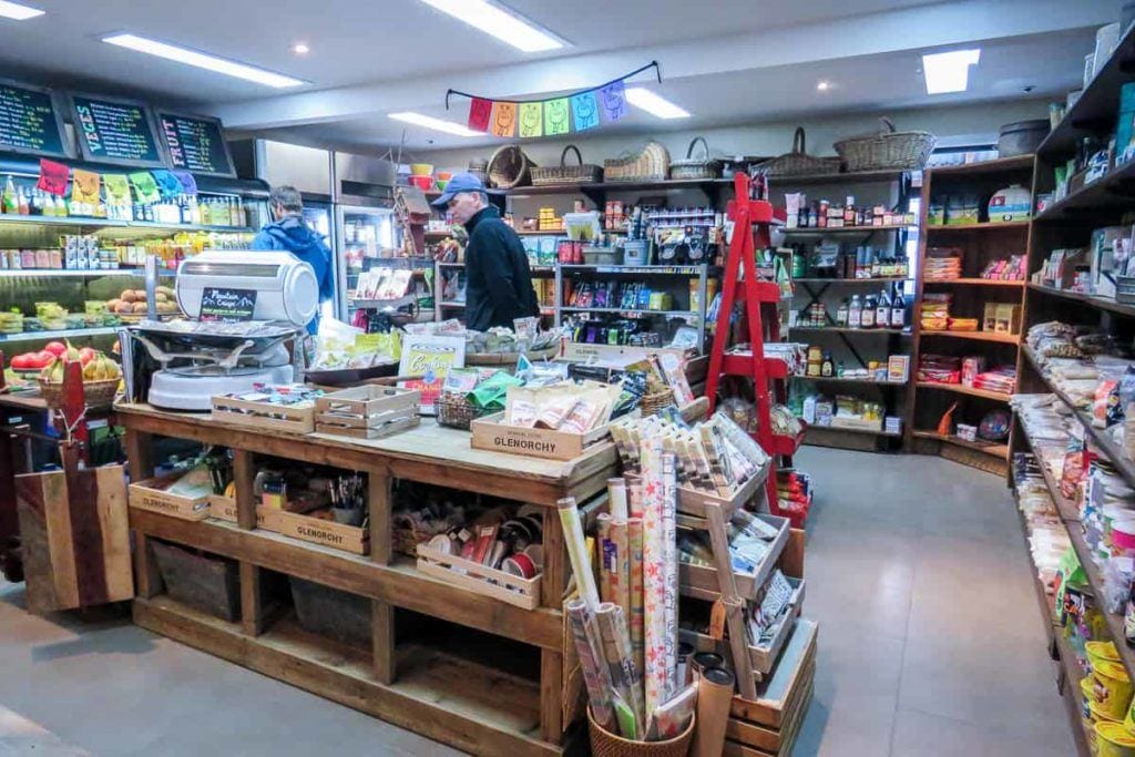 Chris exploring the food section at the general store at Glenorchy