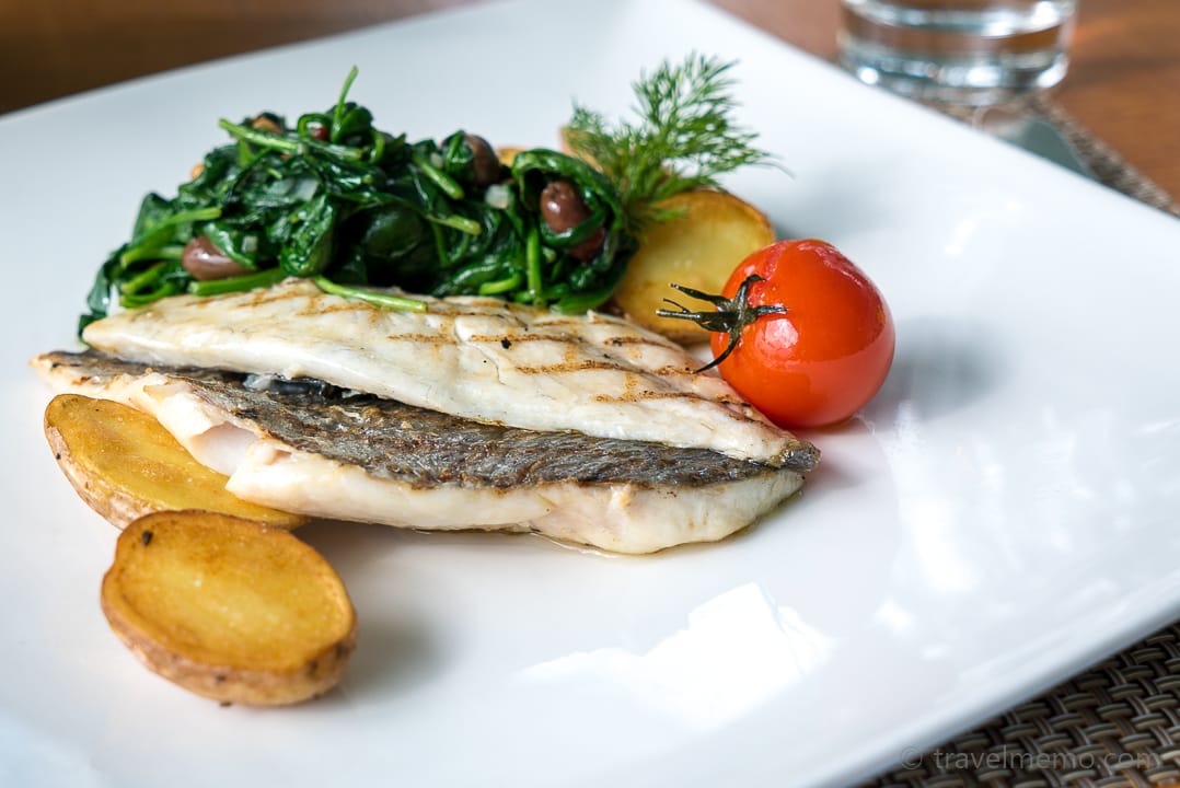 Grilled seabream on young spinach