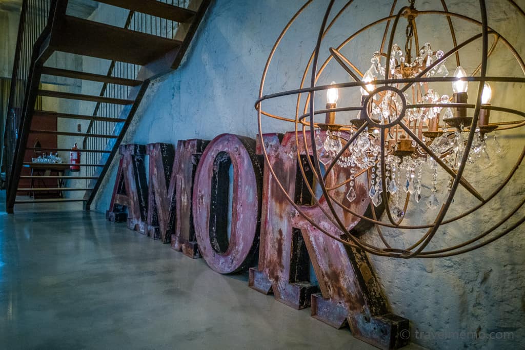AMOR lettering and chandelier of iron