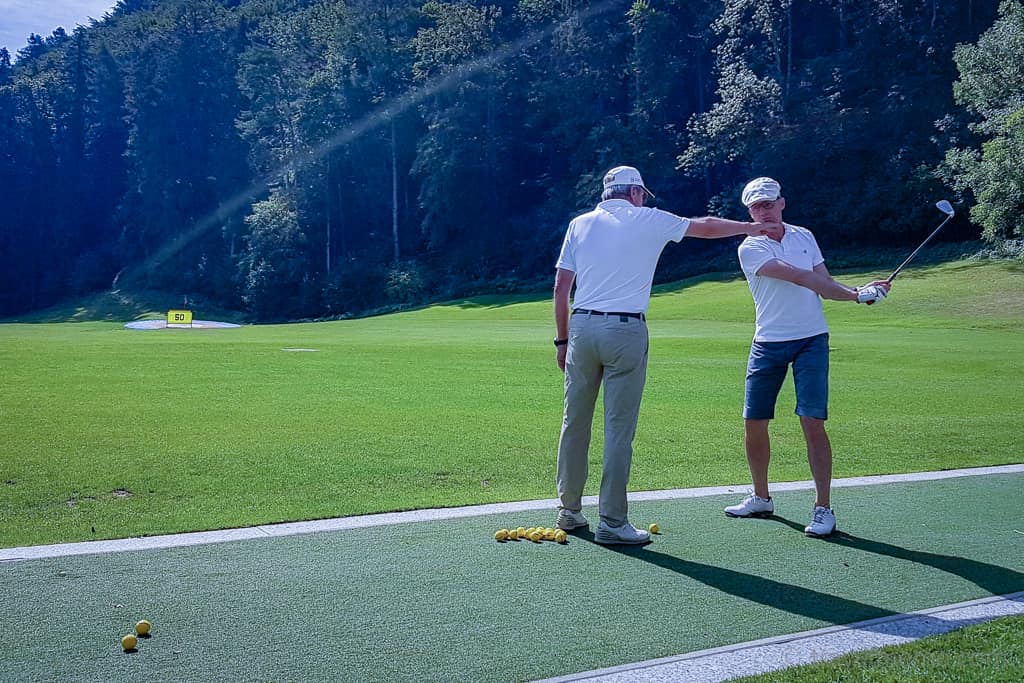 Golf pro Mario gives Walter a lesson