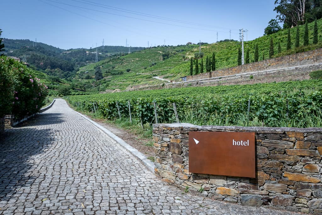 Six Senses Douro Valley's cobblestone drive leads through vineyards