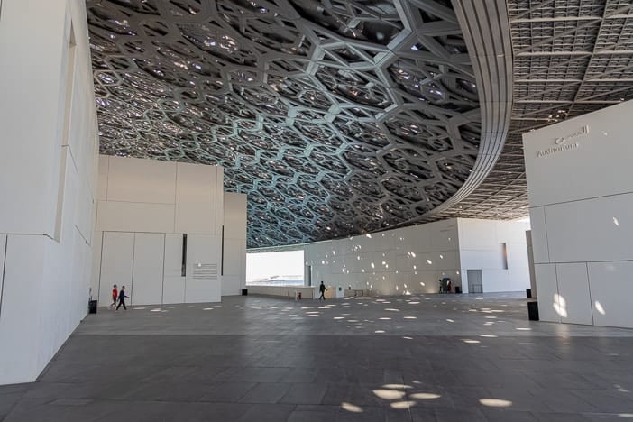 The aluminum cupola's 180-meter span covers the Louvre Abu Dhabi