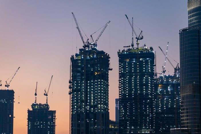 Construction cranes by Burj Khalifa in Dubai
