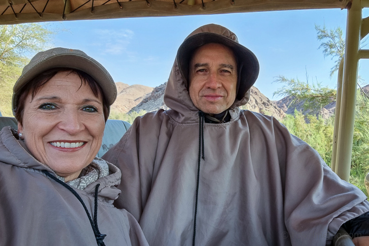 Katja and Walter hooded in safari ponchos