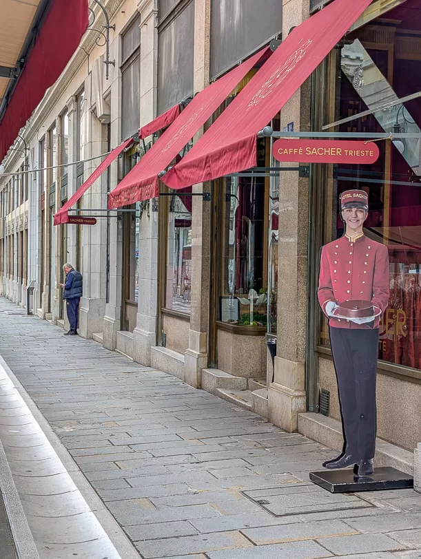 What to Do in Trieste: Explore Italy's Coffee Capital One Cup at a Time 5 | travel memo "Waiter" in front of Caffè Sacher Trieste