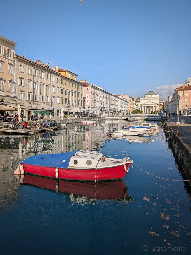 What to Do in Trieste: Explore Italy's Coffee Capital One Cup at a Time 1 | travel memo Boat on Canale Grande di Trieste